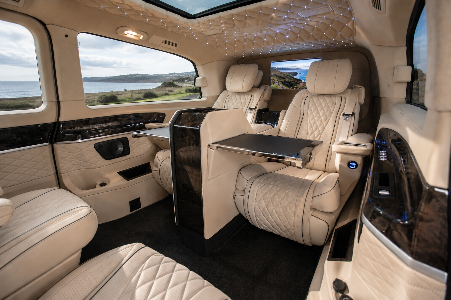 Side view of the diamond-quilted leather seating and glass roof